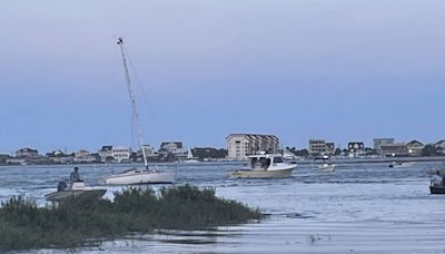 Sailboat once owned by Tom Selleck sinks in Murrells Inlet after being removed from beach