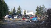 City sues Bellingham property owner over this large homeless encampment