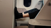 Mixed reactions over photo of SIA business class passenger putting their feet up against another seat
