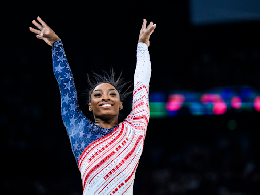 The glory of gold: Simone Biles grins as Team USA triumphs at women's team final