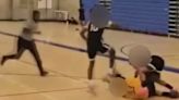 Teenage basketball player viciously STOMPS on opponent's head in game