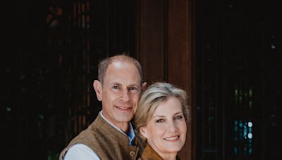 Edward and Sophie embrace in silver wedding anniversary portrait