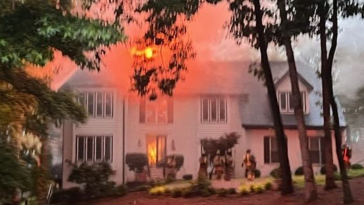 Multiple fire departments respond to massive house fire in Sandy Springs