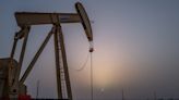 Oil prices hold firm as crude inventories fall and U.S. inflation eases