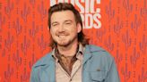 Country singer Morgan Wallen has been arrested after police say he threw a chair off of the roof of a 6-story bar