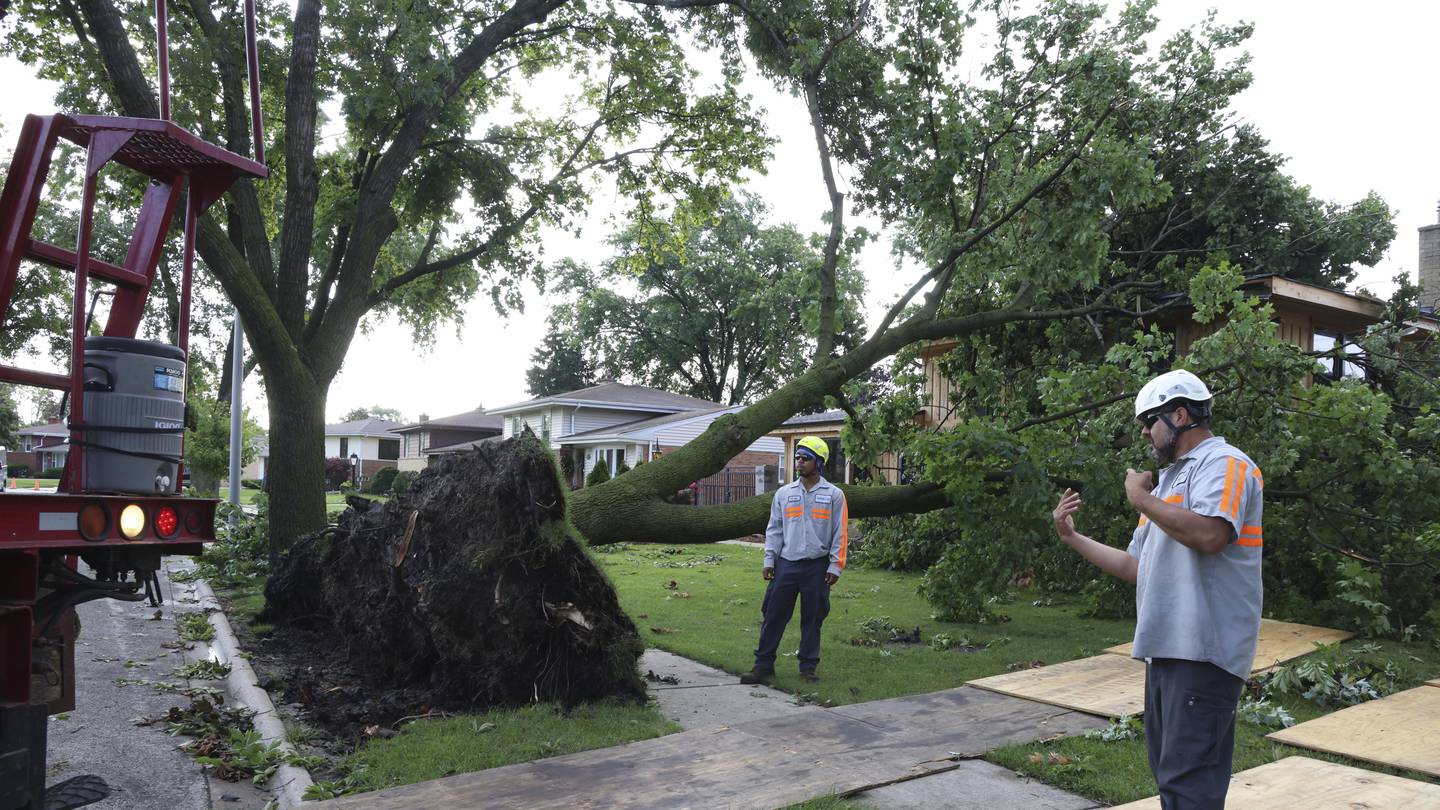 A dam fails after rain, wind, tornadoes pound the Midwest. The Chicago area is cleaning up