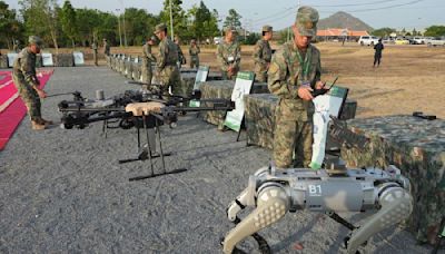 Chinese military shows off rifle-mounted robot dogs at joint exercise with Cambodia