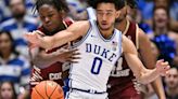...battles Duke's Jared McCain for a loose ball during the second half at Cameron Indoor Stadium on Saturday, Feb. 10, 2024, in Durham, North Carolina...