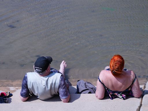 In Pictures: Beachgoers and Glastonbury revellers make most of hot weather