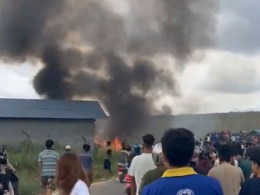 Horror as passenger jet skids off runway & crashes in flames killing 18 on board