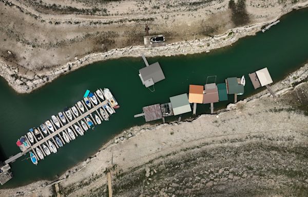 Floodgates open to distribute runoff water into Lake Travis from Lake LBJ, Llano River