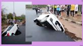 Car trapped as crater develops on road after heavy rain hits Gujarat. Watch video