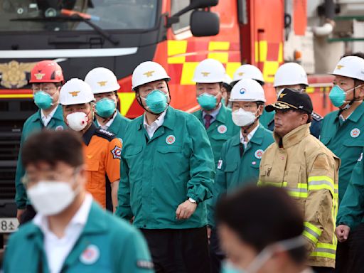 South Korean rescuers search burned factory after a blaze killed 22, mostly Chinese migrants