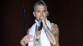 Robbie Williams Recalls 'Unfortunate' Moment When He Pooped Himself on Stage: 'I Retained My Composure'