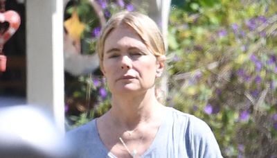 90s TV bombshell, 54, looks completely different as she walks her dog in LA