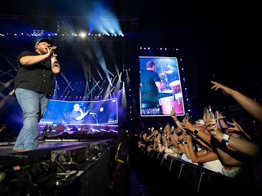 Luke Combs does '1, 2 Many' beer shots with Glen Powell and 'Twisters' stars at MetLife
