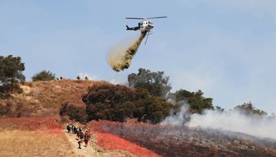 SLO vegetation fire burns hills along Highway 101 on Cuesta Grade, forcing evacuations