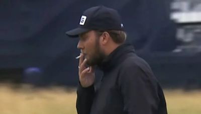 Dan Brown tries to hide smoking from parents at The Open but smiles for selfies