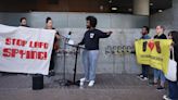 Student Deserve Organizer Matyos Kidane speaks as Stop LAPD Spying Coalition Organizer and LAUSD Teacher Nadia Khan, second from center, and Stop...