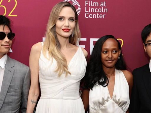 Angelina Jolie puts on united front with children to celebrate stunning new film