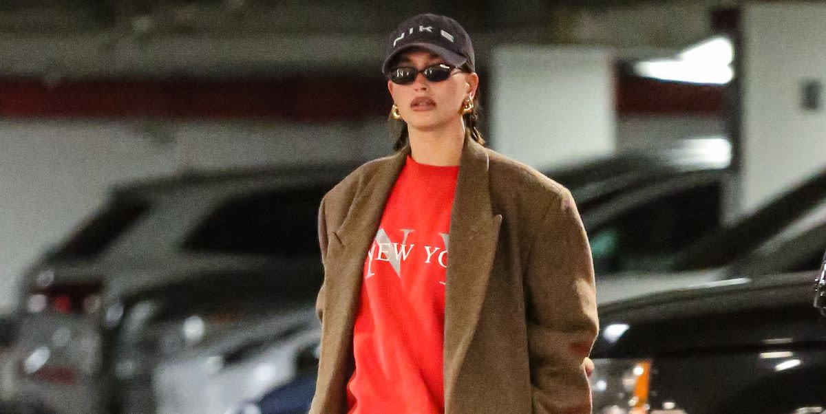 Hailey Bieber Bares Her Baby Bump in a Red Rugby Sweater