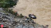 Search for dozens missing after landslide sweeps buses into Nepal river is suspended
