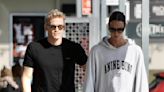 Cody Simpson gives Emma McKeon a playful pat on the bottom