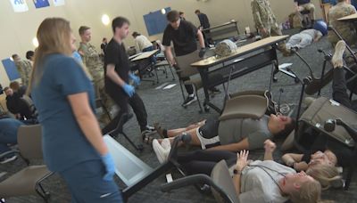 Students train in mock disaster training provided by Michigan National Army Guard