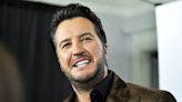 Luke Bryan shares a rare photo with his 15-year-old son, and a very large fish