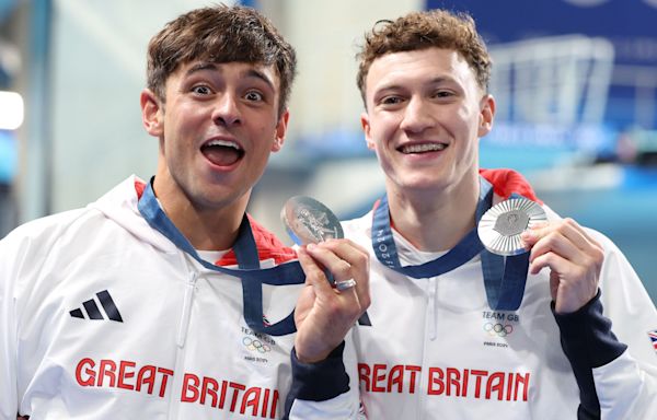 Tom Daley wins silver to complete set of Olympic medals — and is then soaked in fruit juice by son