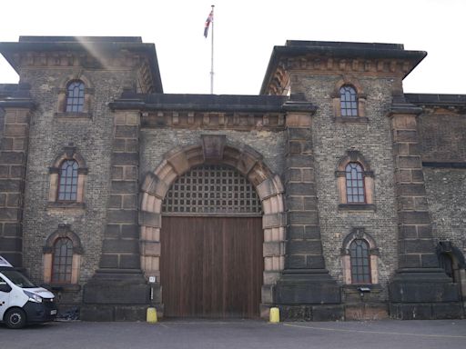 Woman charged over video ‘showing prison officer having sex with inmate in cell’