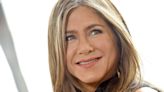 Jennifer Aniston proves beach curls look just as good in winter, sporting her natural hair texture