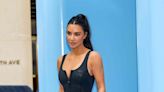 Kim Kardashian Accessorized a Plunging Zip-Up Bodysuit With Sweatpants and Sneaky Pink Thigh-High Boots