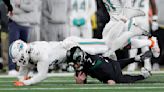 Dolphins' Holland calls MetLife Stadium turf 'trash' after teammate Phillips injures Achilles tendon