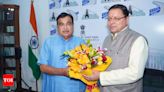 CM Dhami meets Union minister Nitin Gadkari in Delhi to discuss projects | India News - Times of India