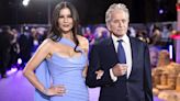 Michael Douglas Says Catherine Zeta-Jones Makes Him Flash Her If He Plays Poorly at Golf: ‘I Have to Whip It Out’