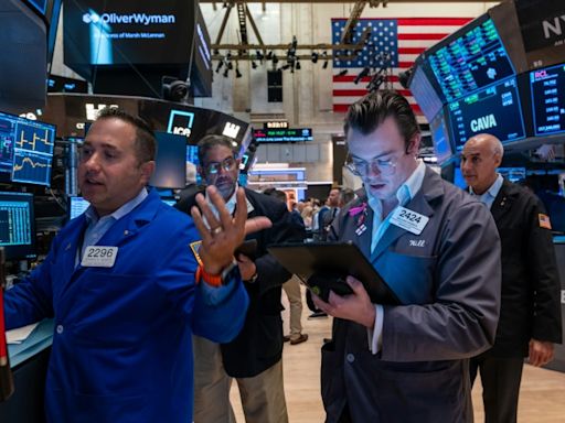 Dow soars to fresh record while gold prices hit all-time high