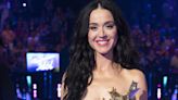 Katy Perry's gold breastplate features seven gold roses in super sentimental reason
