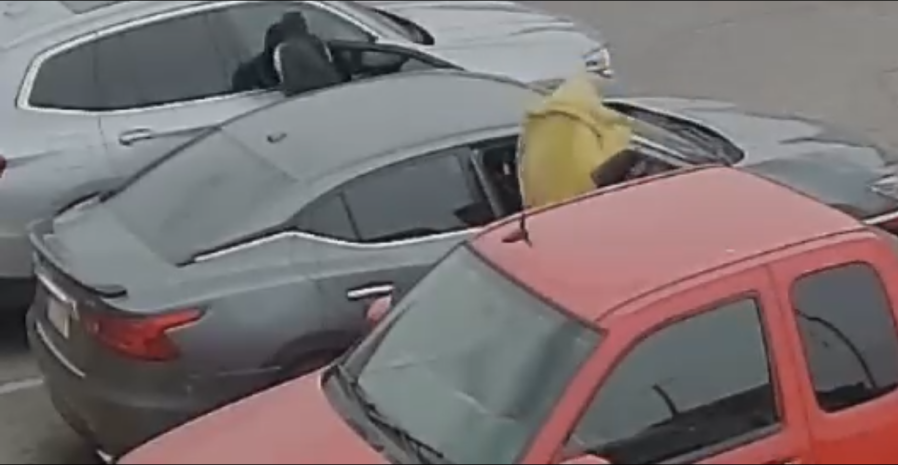 Man caught on camera stealing purse from car in Superlo parking lot