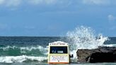 Sea scoops up ice cream van after it gets stuck in sand on beach
