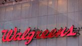 Walgreens cuts profit view, to shut more stores on spending hit