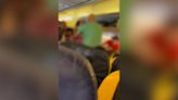 Moment ‘drunk’ woman gets into fight on Ryanair flight to Ibiza before she’s dragged away in headlock