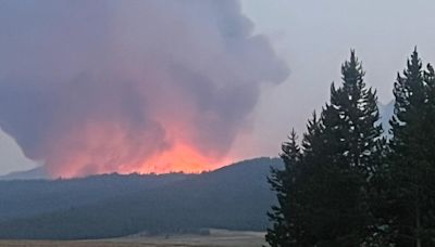 Crews guide Bench Lake Fire into damp terrain, bolstering defenses near Redfish Lodge