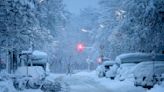 A snowstorm brings Munich airport to a standstill and causes travel chaos in central Europe