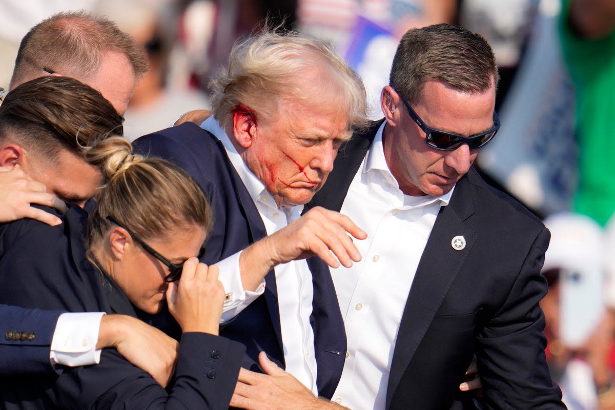 Trump fundraises off assassination attempt as Biden suspends campaign ads in aftermath of rally shooting