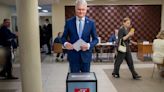 Lithuanians return to the polls with incumbent president favored to win 2nd election round