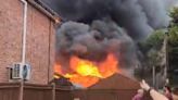 Resident 'ran out of door' as fire tore through sheds