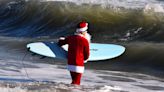 Hundreds of 'hardcore' Surfing Santas brave frigid wind to hit waves in wintry Cocoa Beach