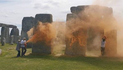 Two eco-activists arrested after Stonehenge sprayed with orange powder