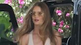 Rosie Huntington-Whiteley goes braless in a nude vest and trousers